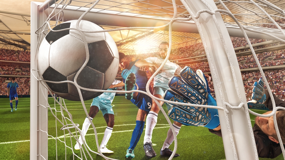 Soccer,Action,With,The,Striker,Who,Scores,A,Goal,At